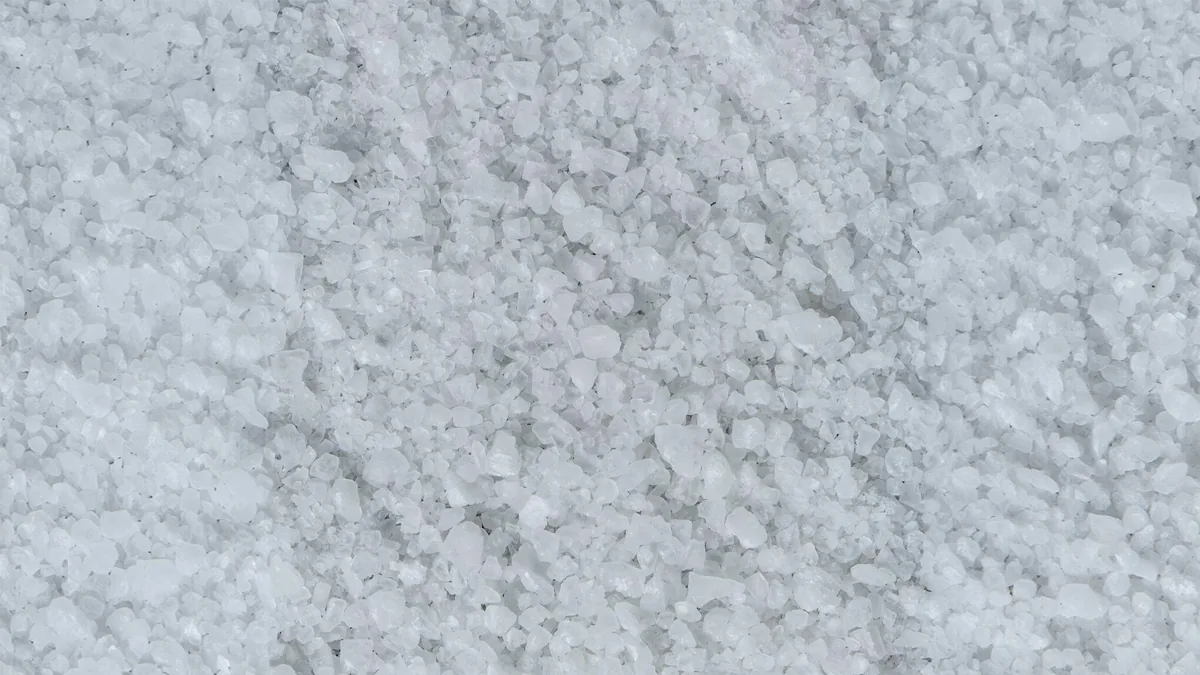 A pale field of coarse sea salt crystals