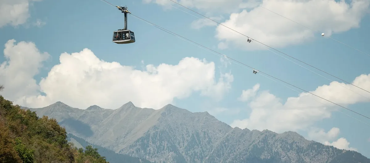 The Vigiljoch cable car passing above the mountains near Lana