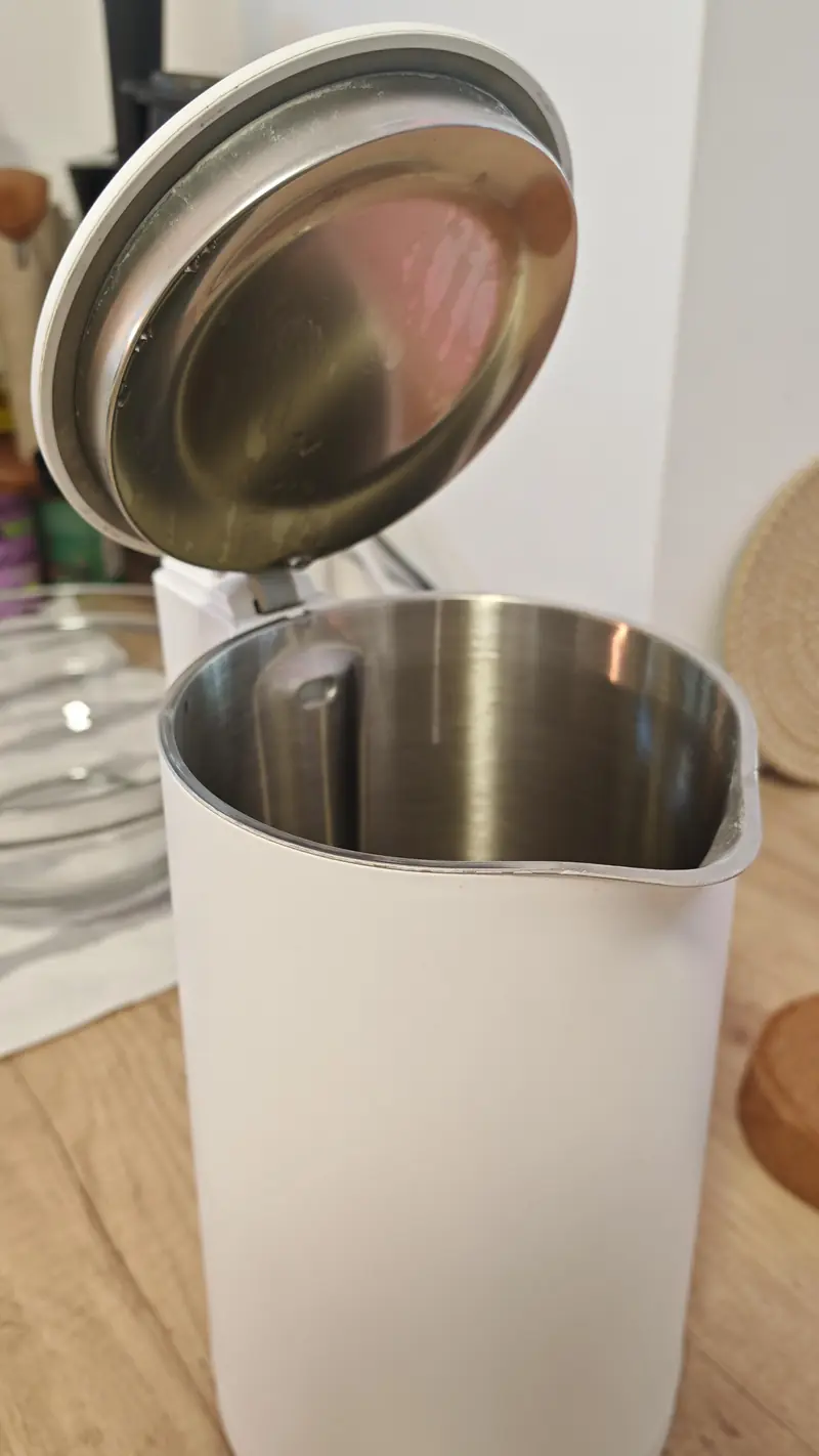 An open kettle showing a full stainless-steel interior